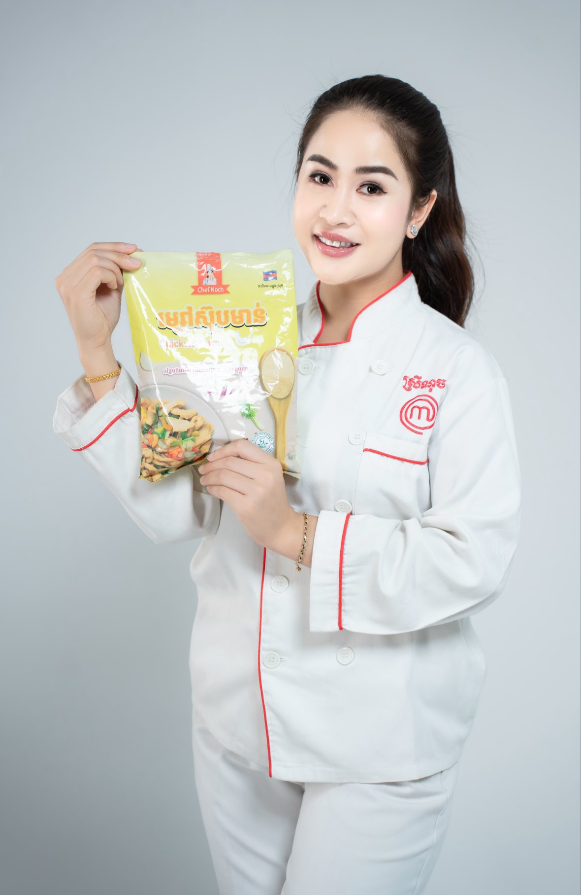 Chef Noch founder Pich Sreinuch holding Chef Noch Chicken Powder